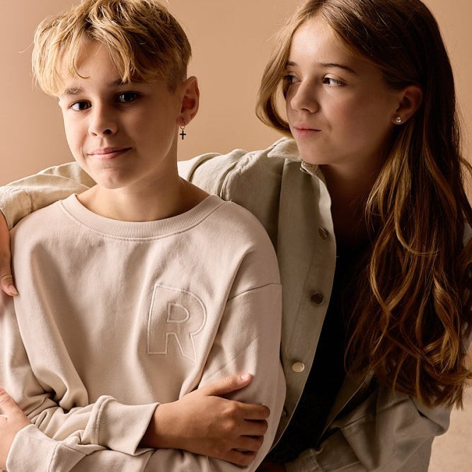 Blomdahl titanium oorringen met kruisje – 14 mm
