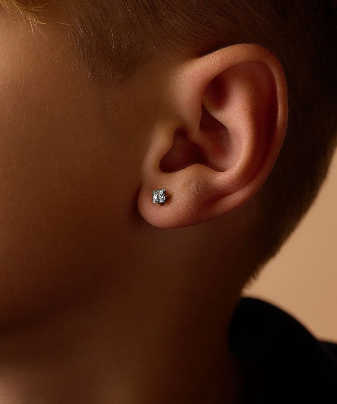 Oorbellen Blomdahl titanium goudkleurig knopje 5 mm. aqua zirconiasteentje