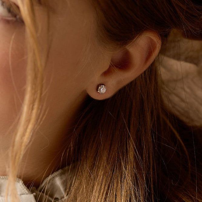 Oorbellen Blomdahl titanium goudkleurig knopje 6 mm. zirconiasteentje