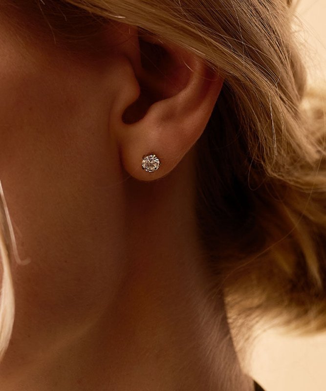 Oorbellen Blomdahl titanium goudkleurig knopje 6 mm. zirconiasteentje