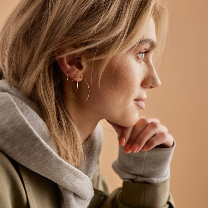 Oorbellen Blomdahl titanium goudkleurige oorringen 12 mm. - Staartjes en Strikjes