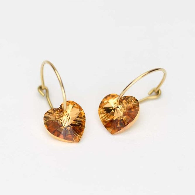 Oorbellen Blomdahl titanium goudkleurige oorringen – 14 mm kristallen hartje bronze