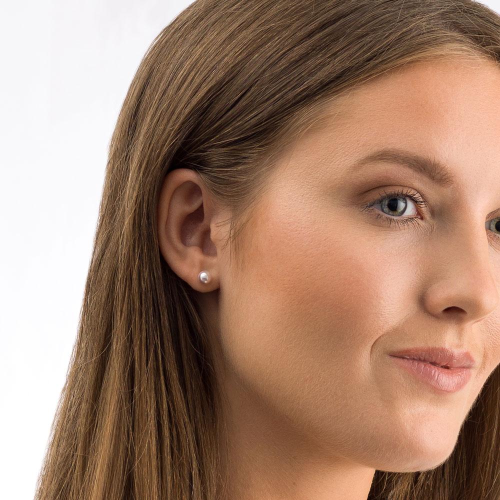 Oorbellen Blomdahl titanium parel licht roze 6 mm.