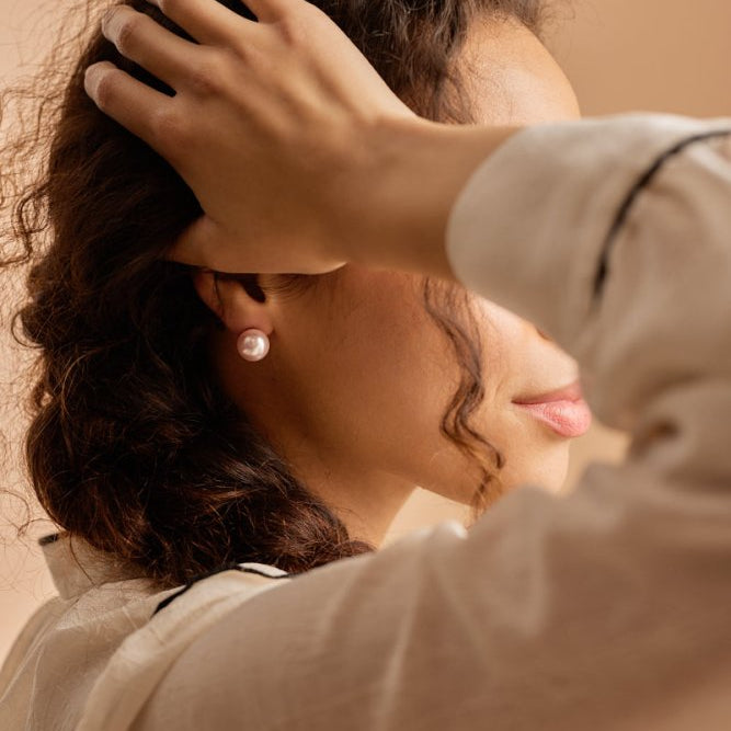 Oorbellen Blomdahl titanium parel lichtroze 12 mm. (incl. achterkantjes) - Staartjes en Strikjes