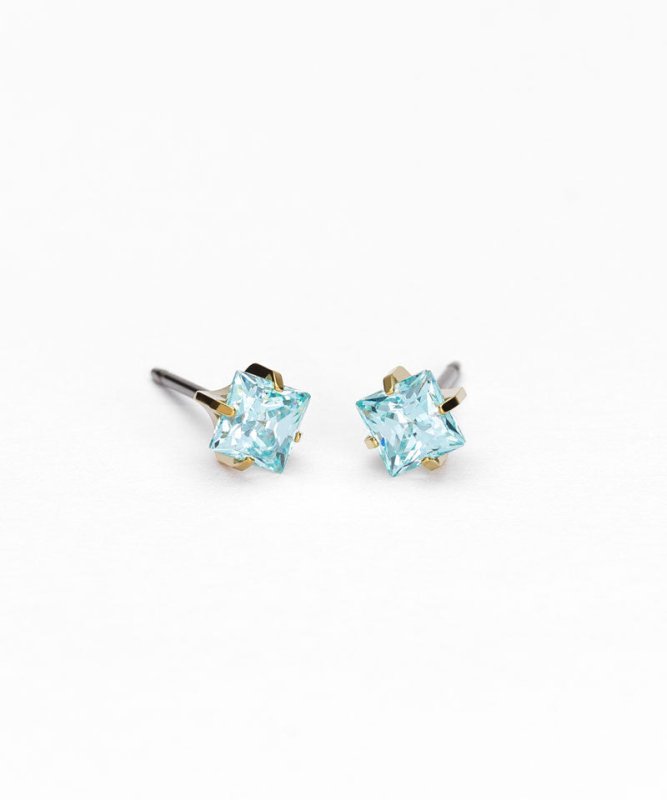 Oorbellen Blomdahl titanium goudkleurig knopje 5 mm. aqua zirconiasteentje