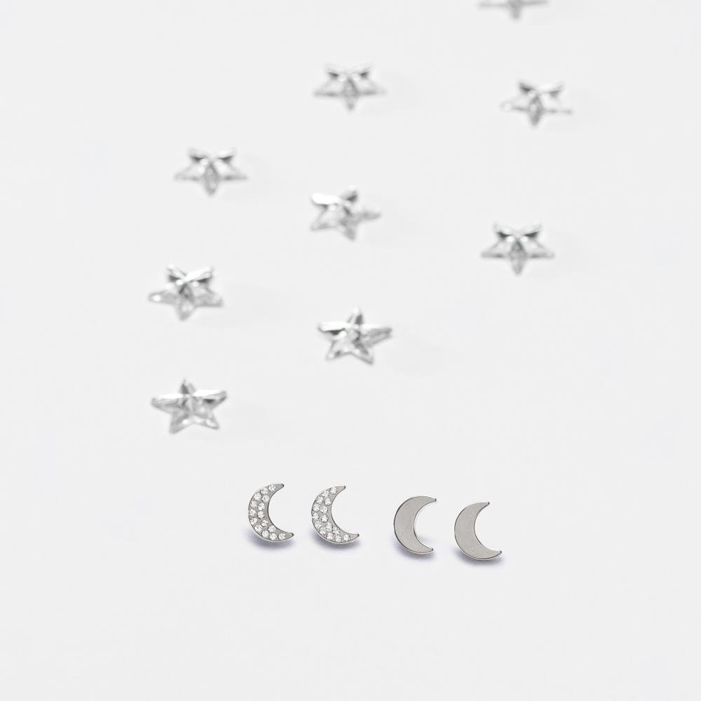 Oorbellen Blomdahl titanium maan zilverkleurig met Swarovski kristalletjes. - Staartjes en Strikjes
