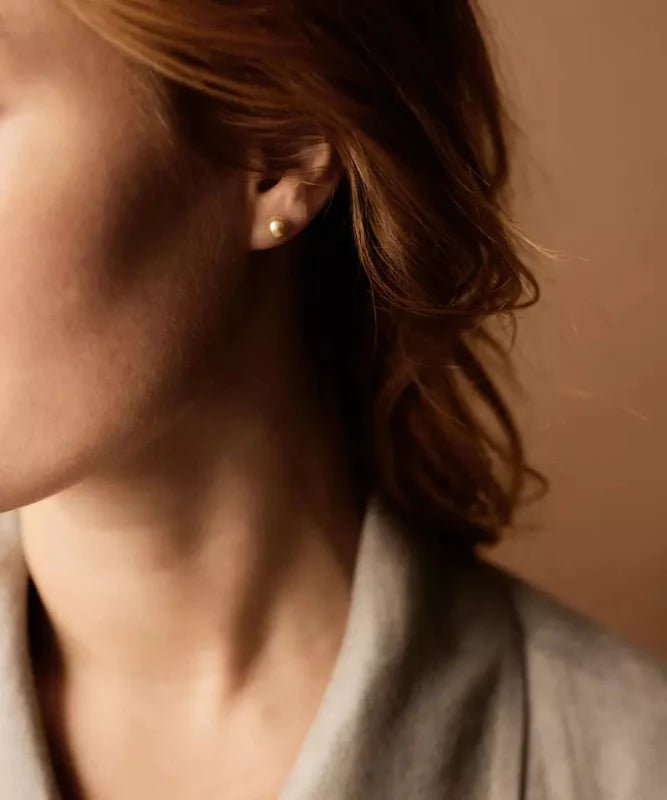 Oorbellen Blomdahl titanium parel golden shimmer 6 mm. (incl. achterkantjes)